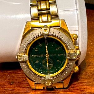 Guess women’s Gold and Green Watch